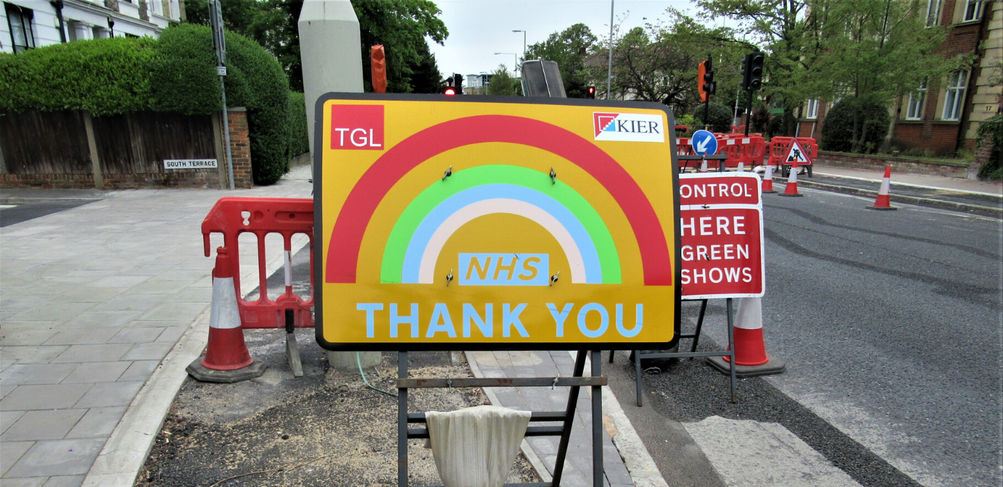 A traffic sign on Ewell Road thanking the NHS with a rainbow