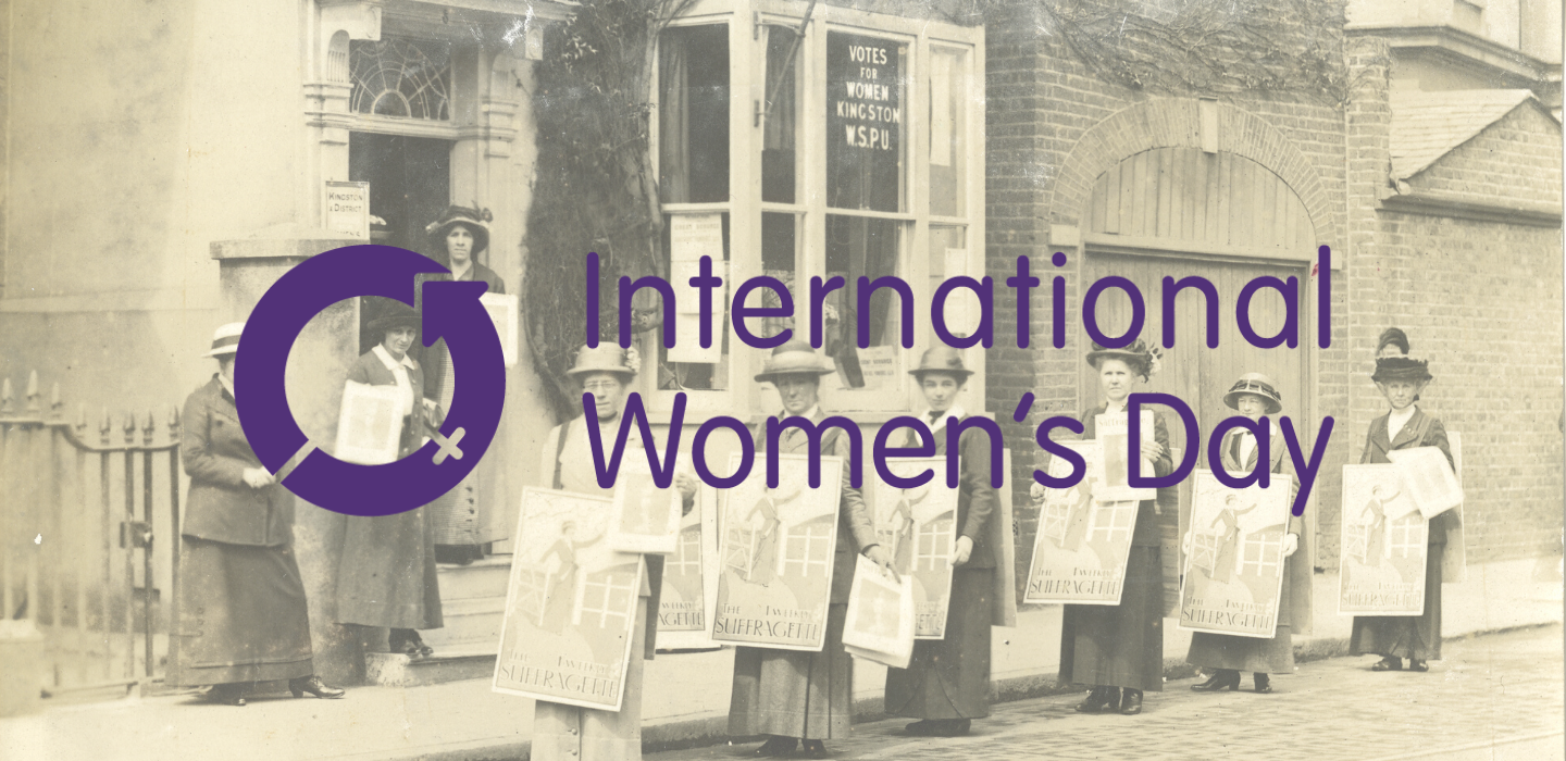 Suffragettes in Kingston behind the International Women's Day logo