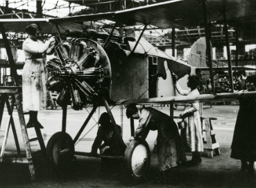 A photograph of women working on a plane in an aircraft factory from the photo collection at Kingston History Centre.