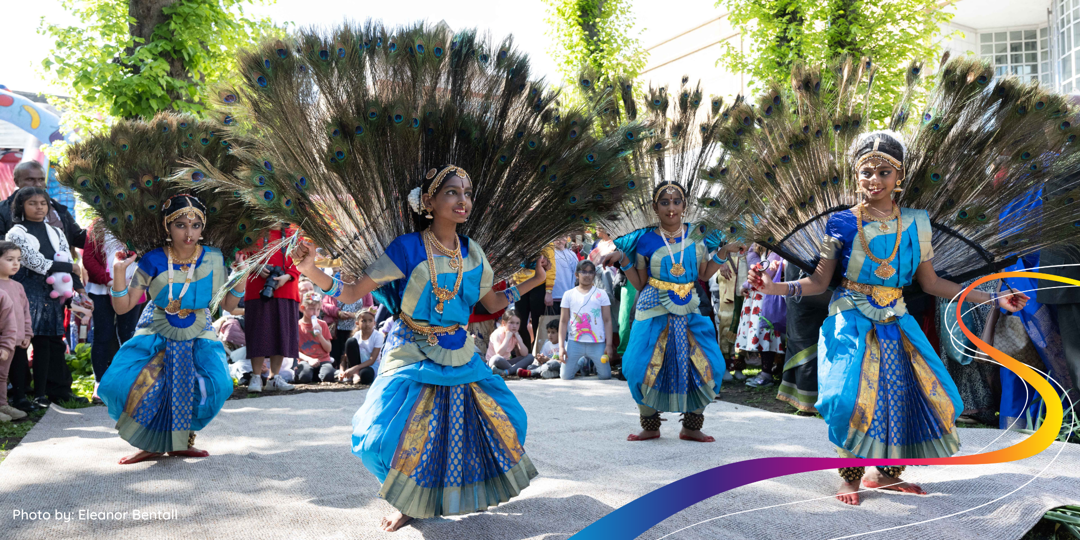 Women dancing in traditional Tamil costumes