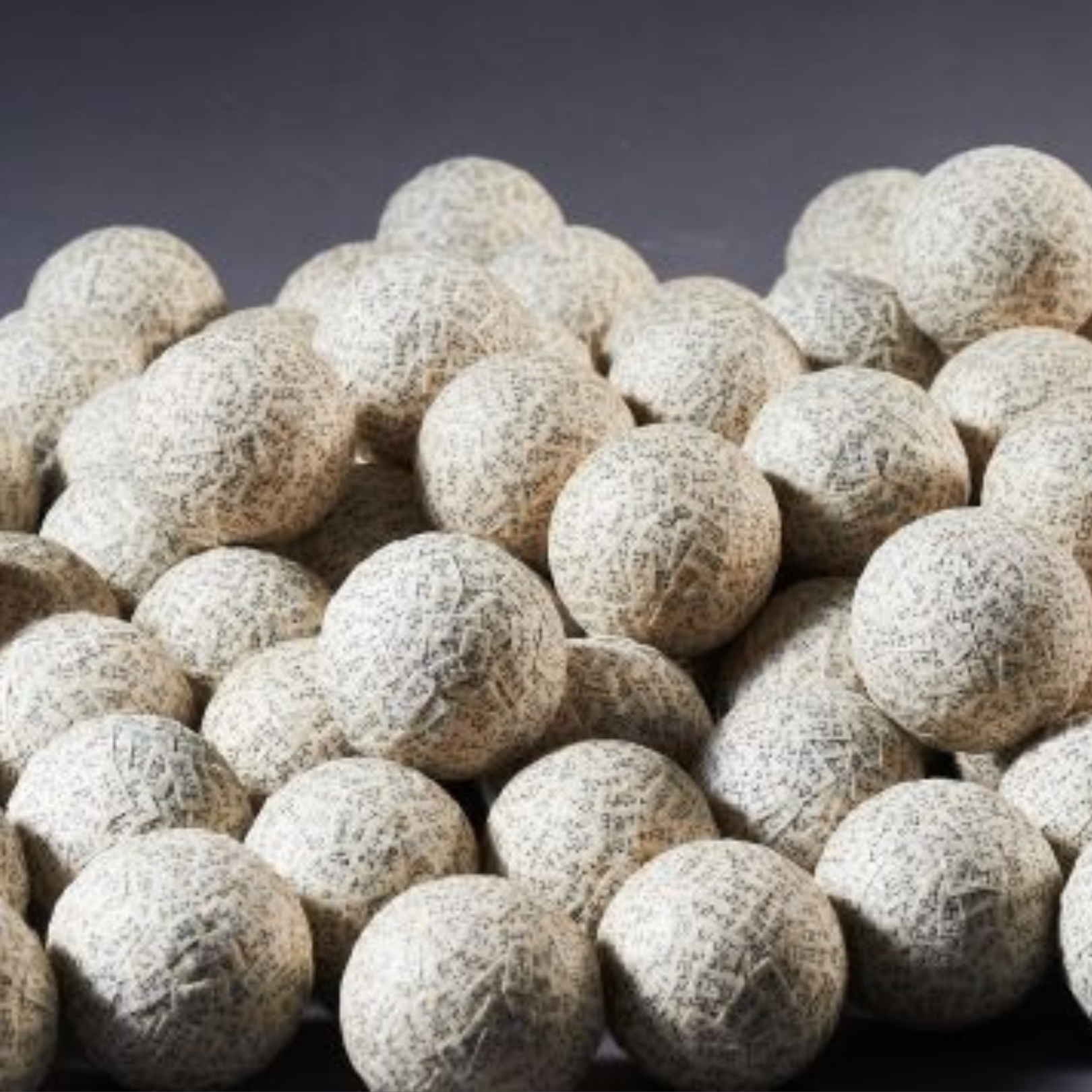 Invocation (2015), Collage on 100 spheres, Korean mulberry paper, ink, cypress wood