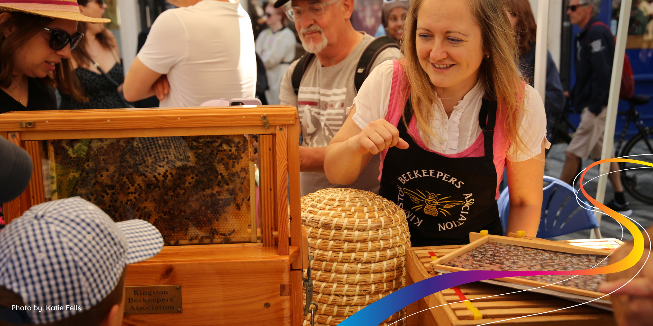 Kingston Beekeeper members talking to a young person during the Saxon Fayre 2024