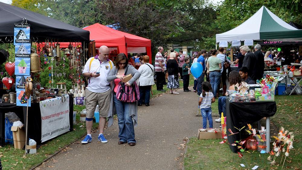 People visiting stalls in St James Square at Surbiton Festival
