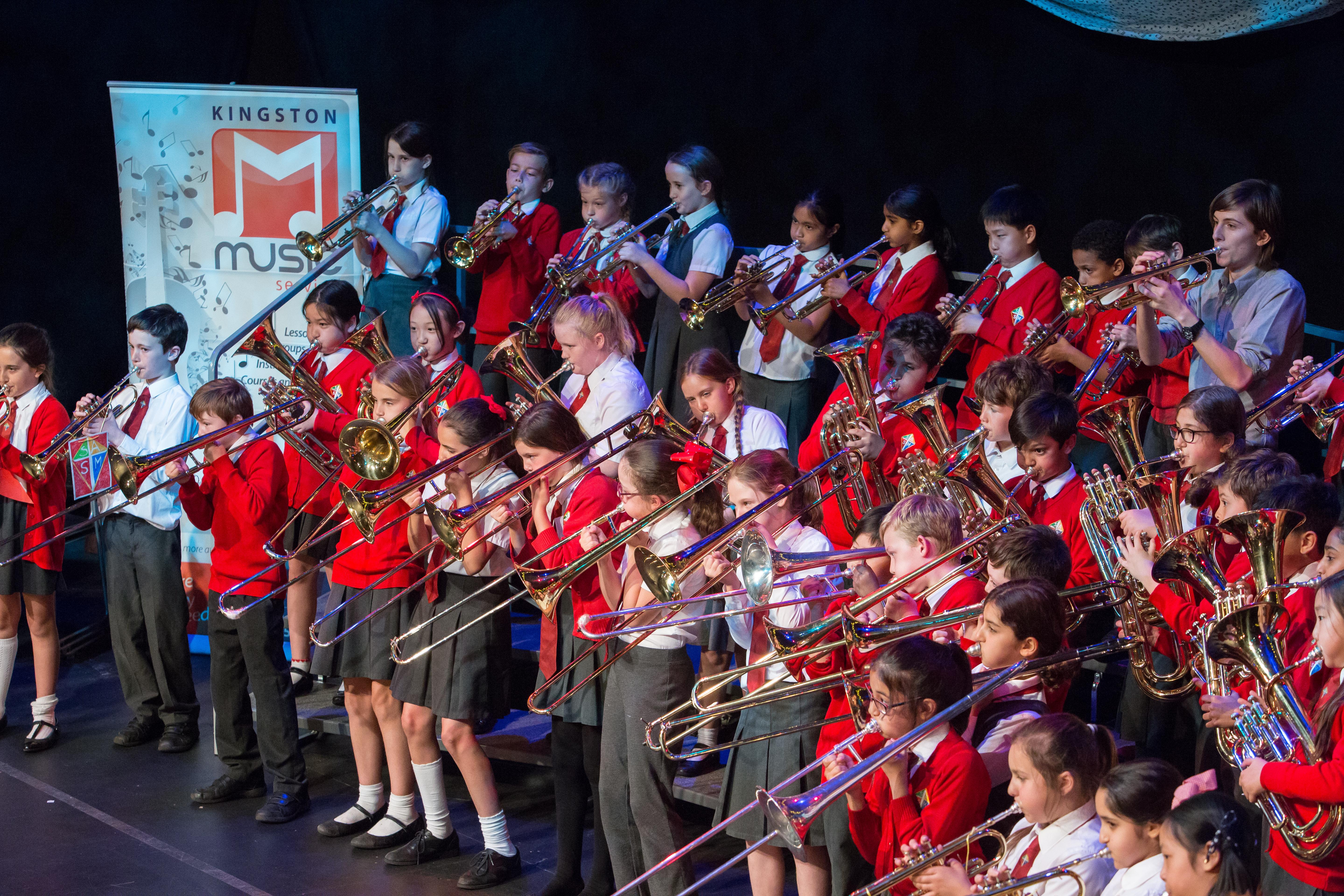 Students performing on brass instruments