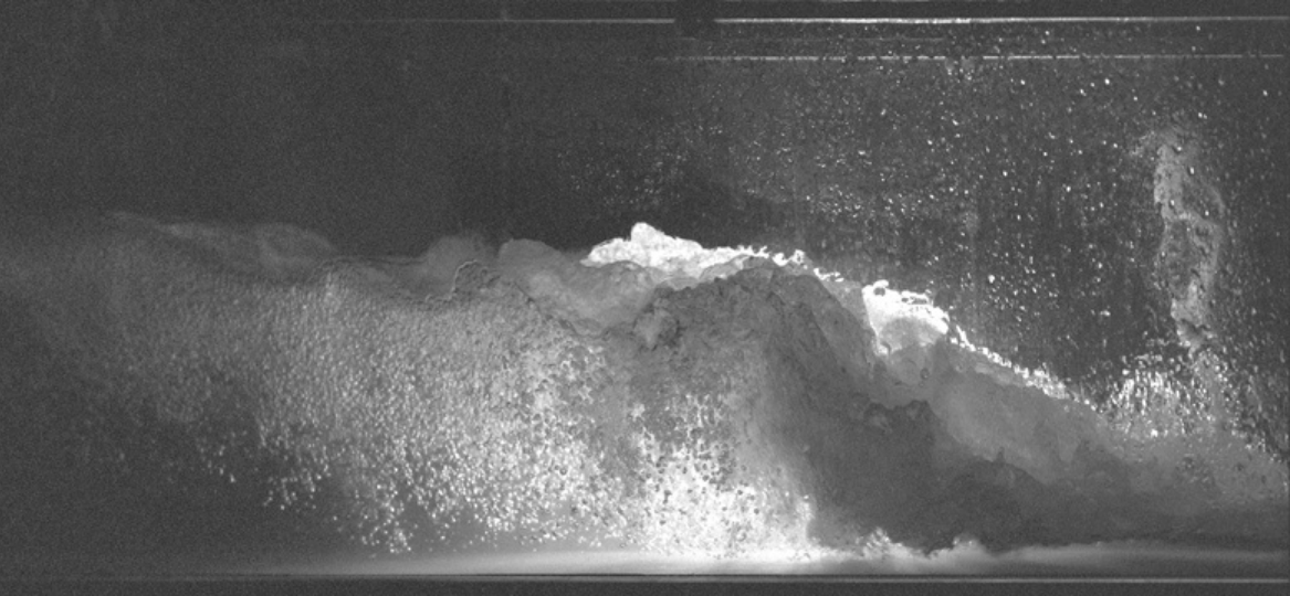 A black and white photograph taken by photographer Chris Arthur of water in movement.
