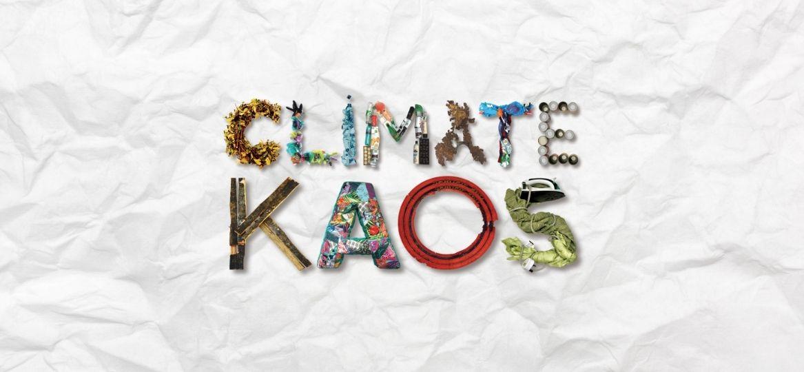 'Climate KAOS' spelt out with recycled waste items such as fabrics, plastic bottles etc.