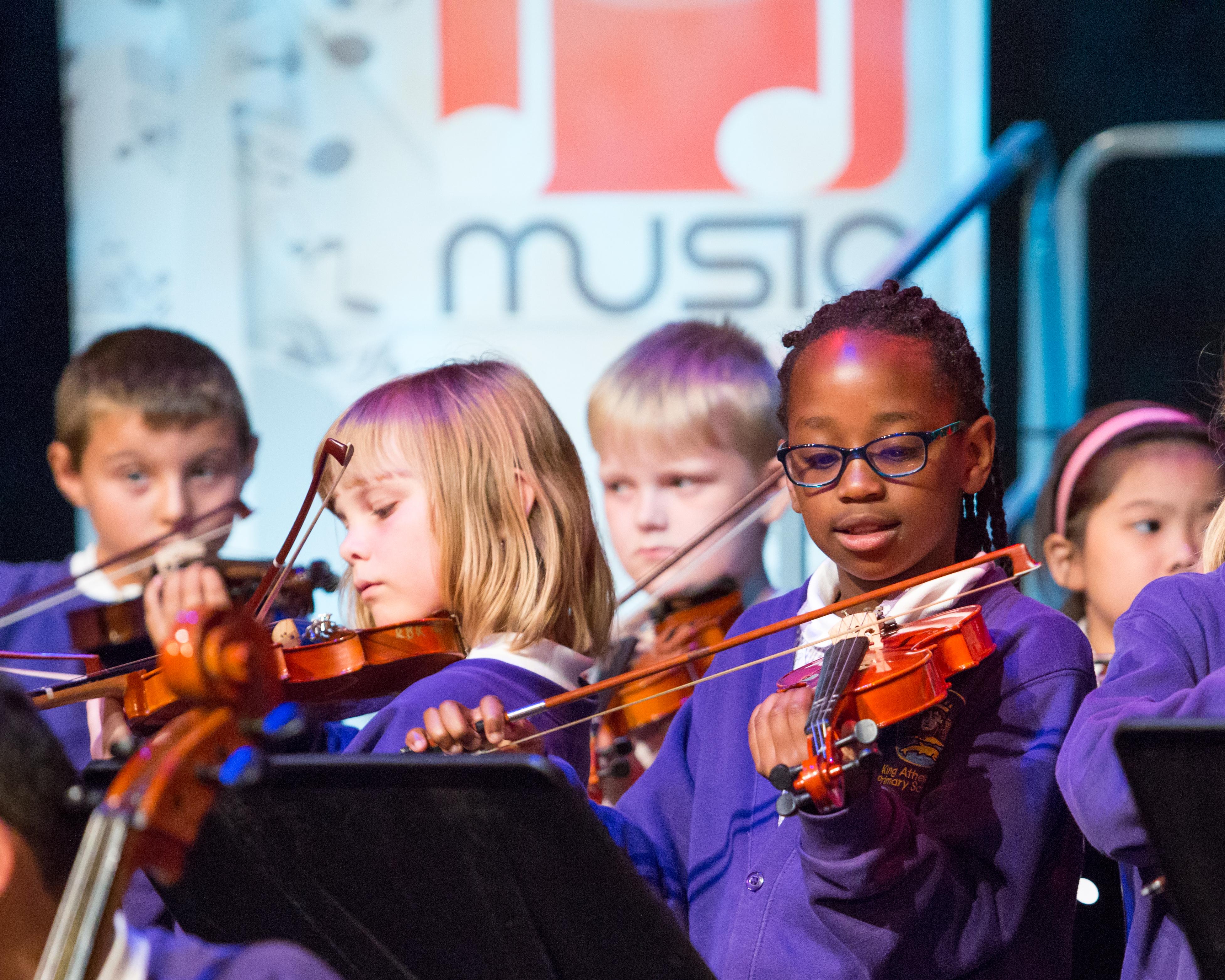 Children playing violins