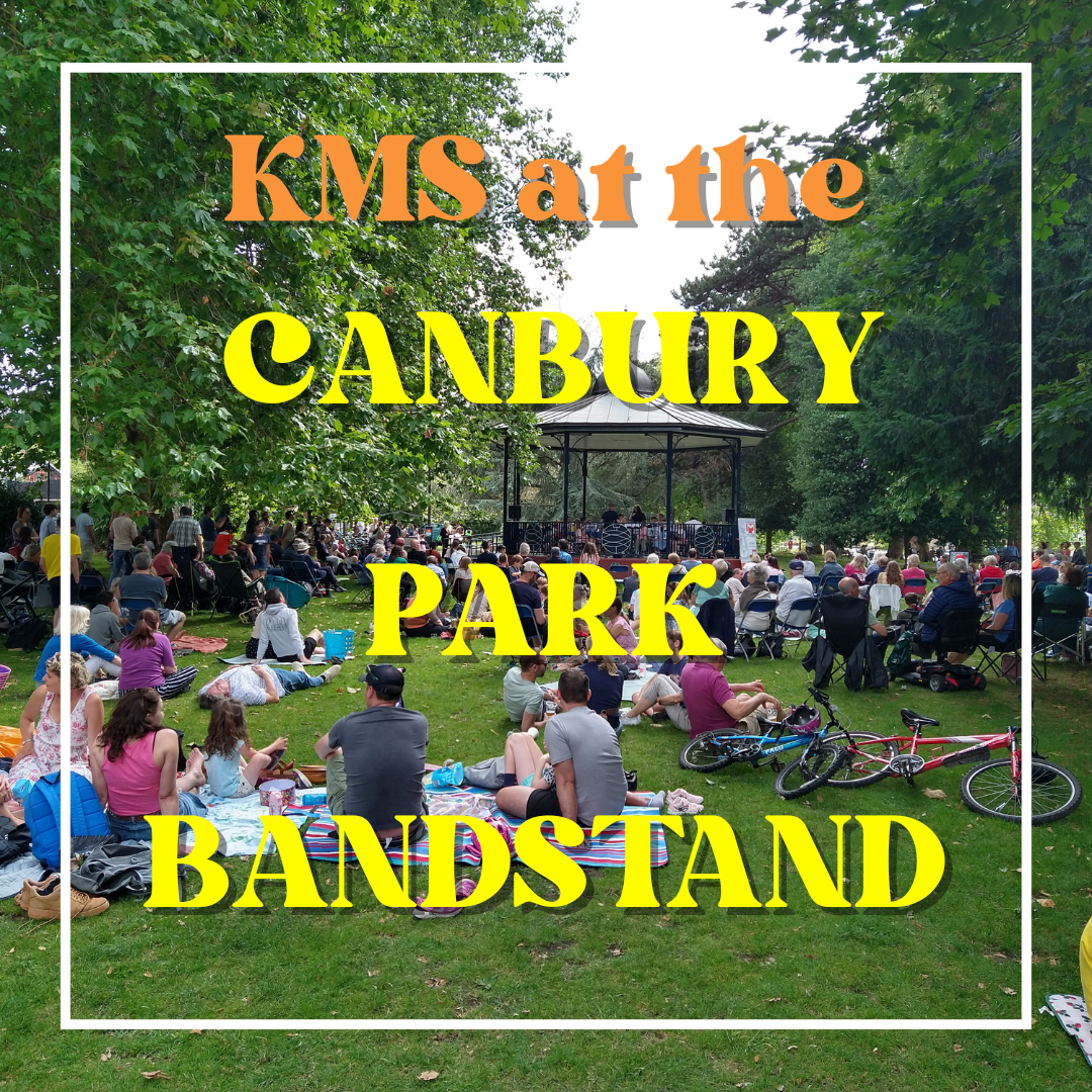 Background is an image of Canbury Park Bandstand with lots of people sitting around watching. Over the top is written 'KMS at the Canbury Park Bandstand'