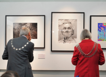 The Mayor looking at photographs in the temporary exhibition National Treasures.