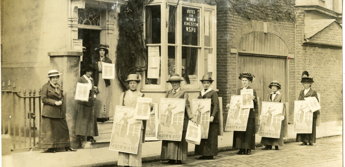 Suffragettes in stood with placards outside of the WSPU shop in Kingston