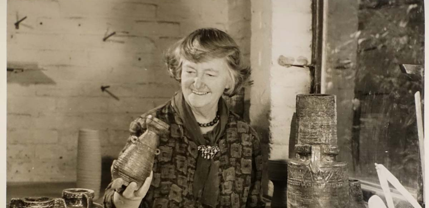 Denise Wren at Oxshott in 1968 with her saltglazed stoneware pots from the Commonwealth Institute Exhibition of 1967.