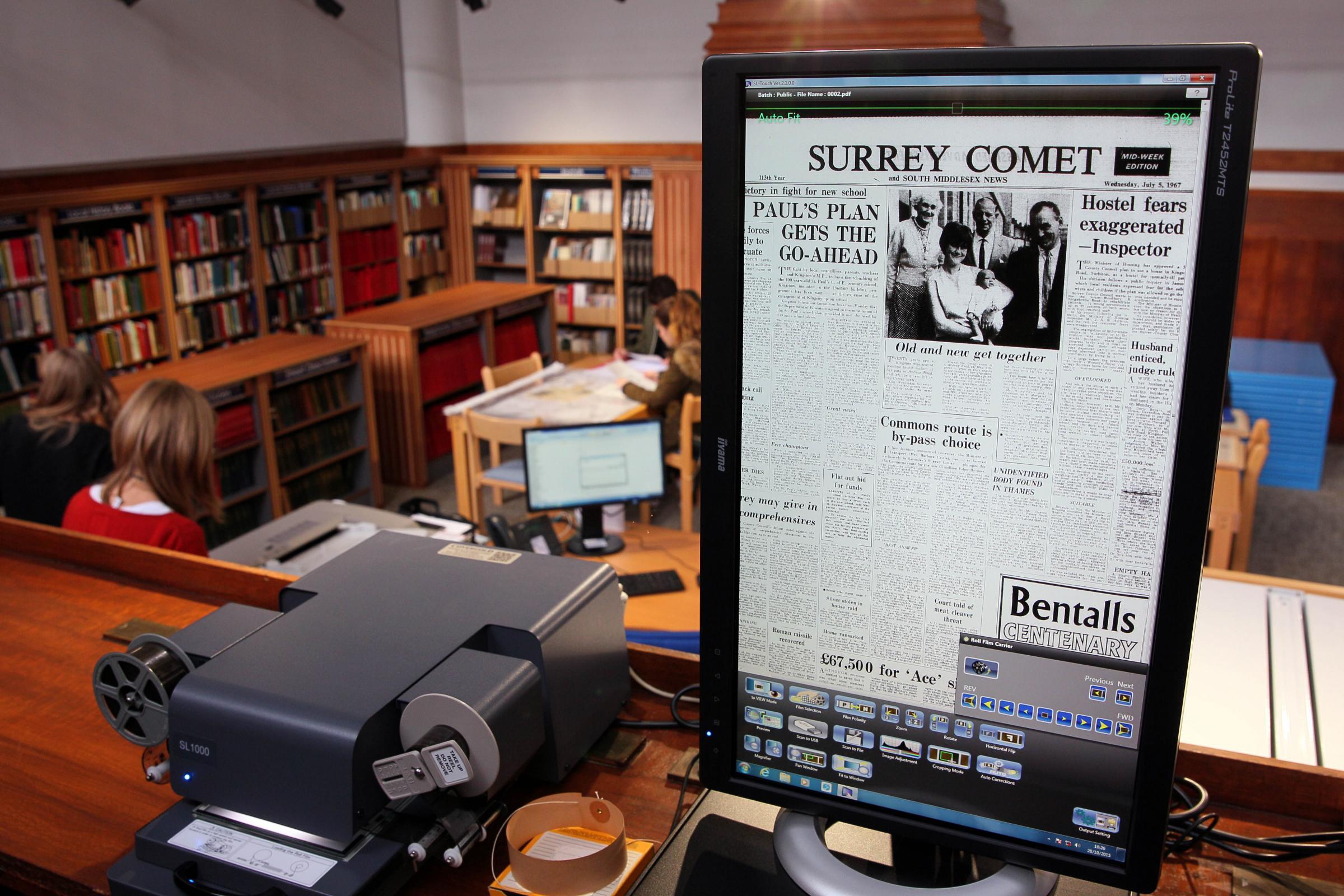 A screen showing an old edition of the Surrey Comet in the local history library