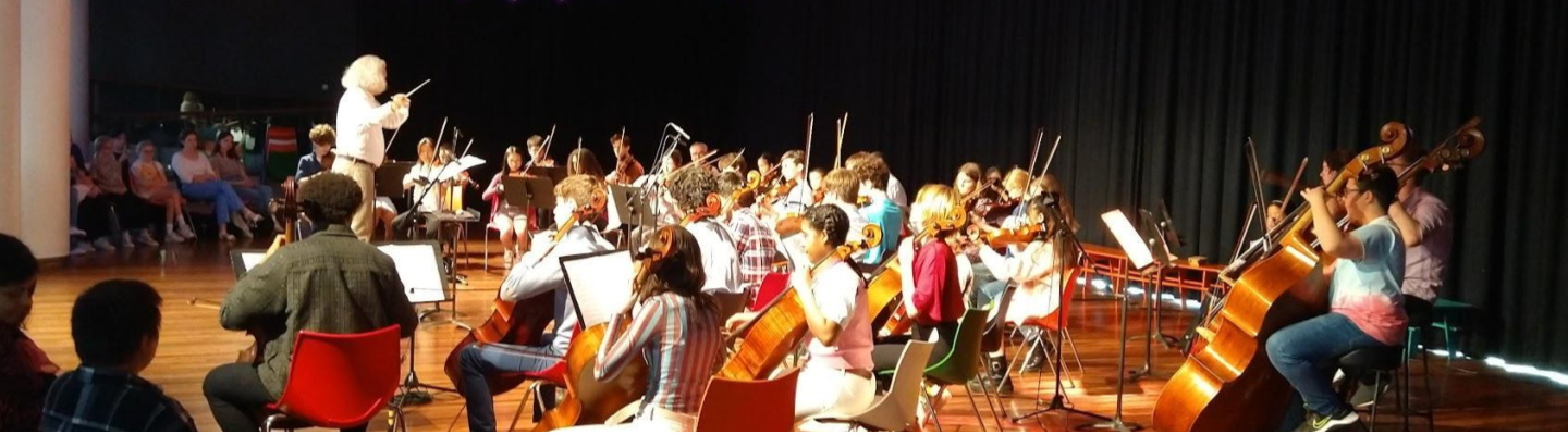 A large group of musicians playing in a group at the Southbank Centre