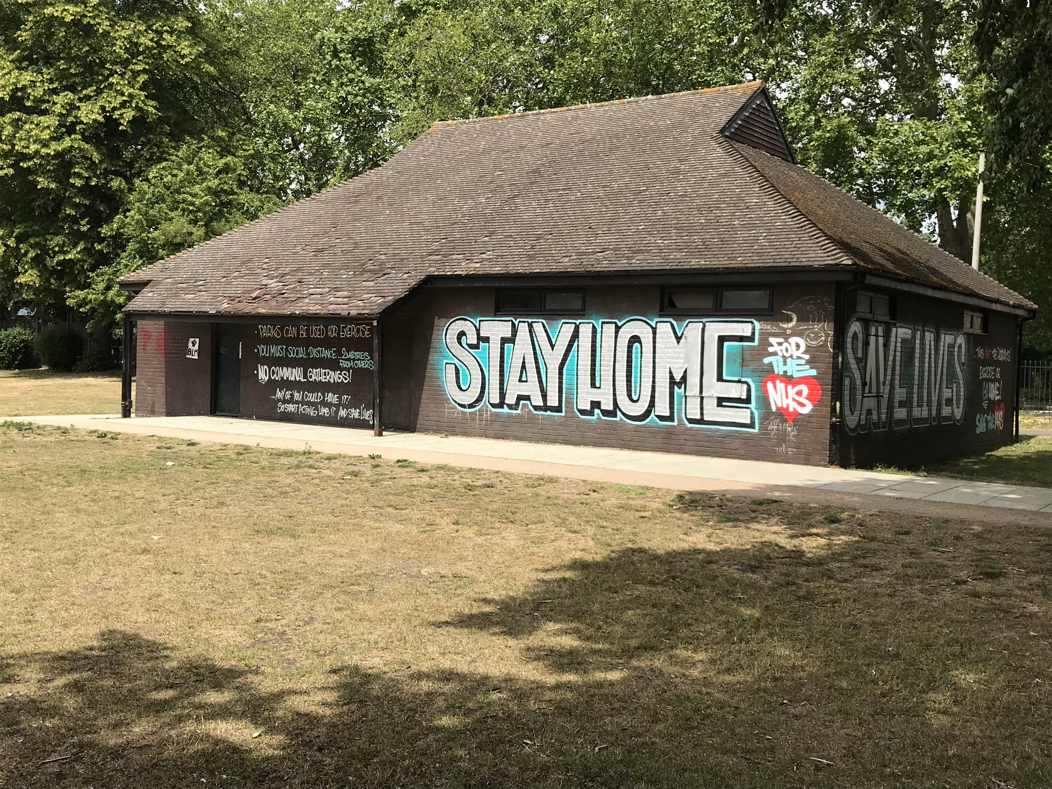 Graffiti style artwork saying &#039;Stay home, save lives&#039; on the building in the Fairfield.