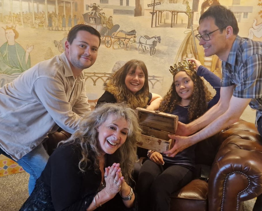 A group of 5 people have fun on a heritage treasure hunt. 