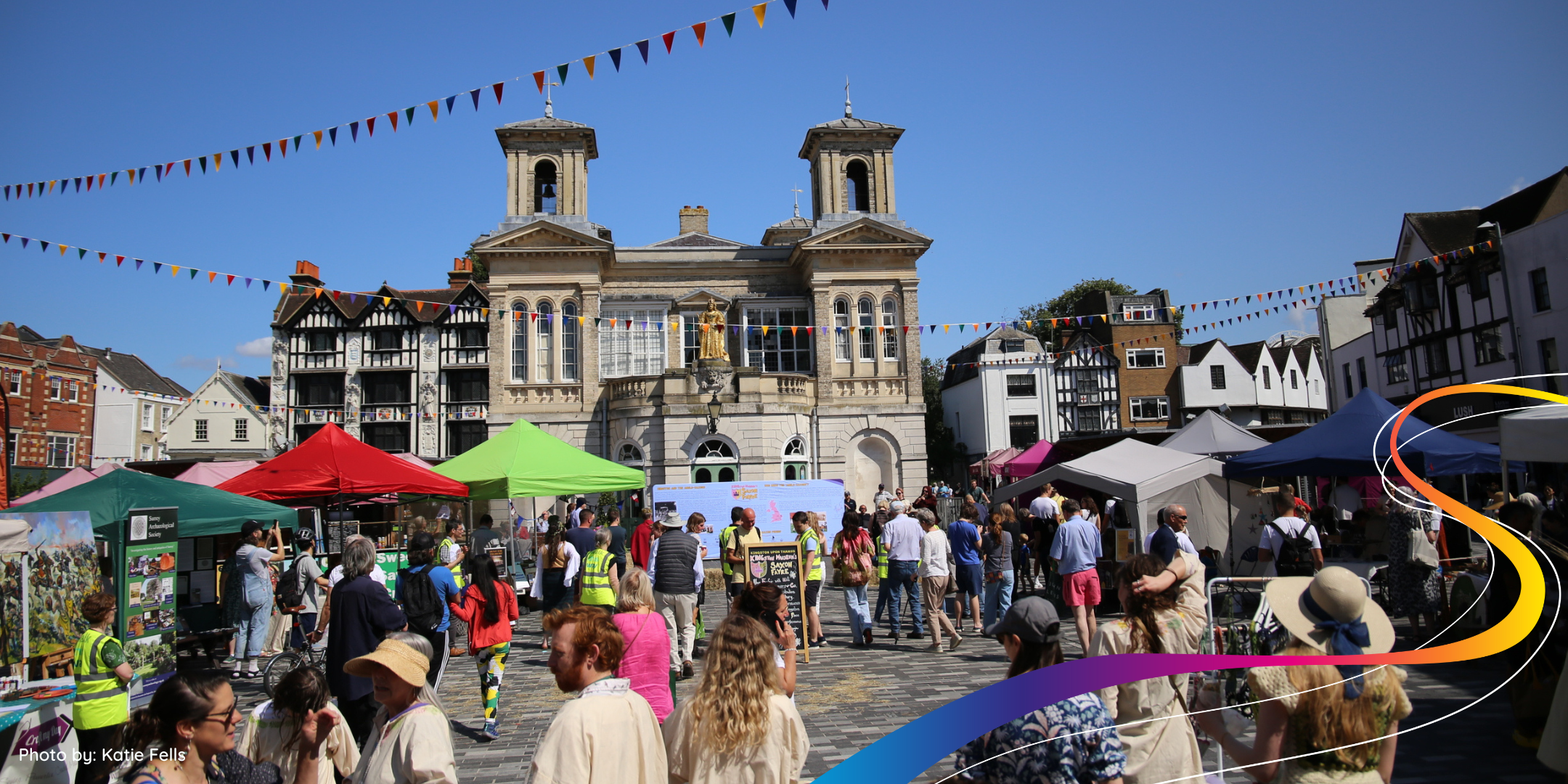 Kingston market place full of people at saxon faryre 2024 on a sunny day