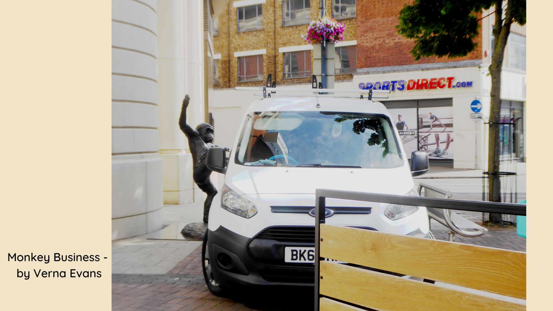 Monkey statue and white van