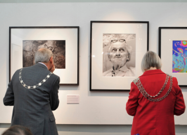 two people looking at pictures