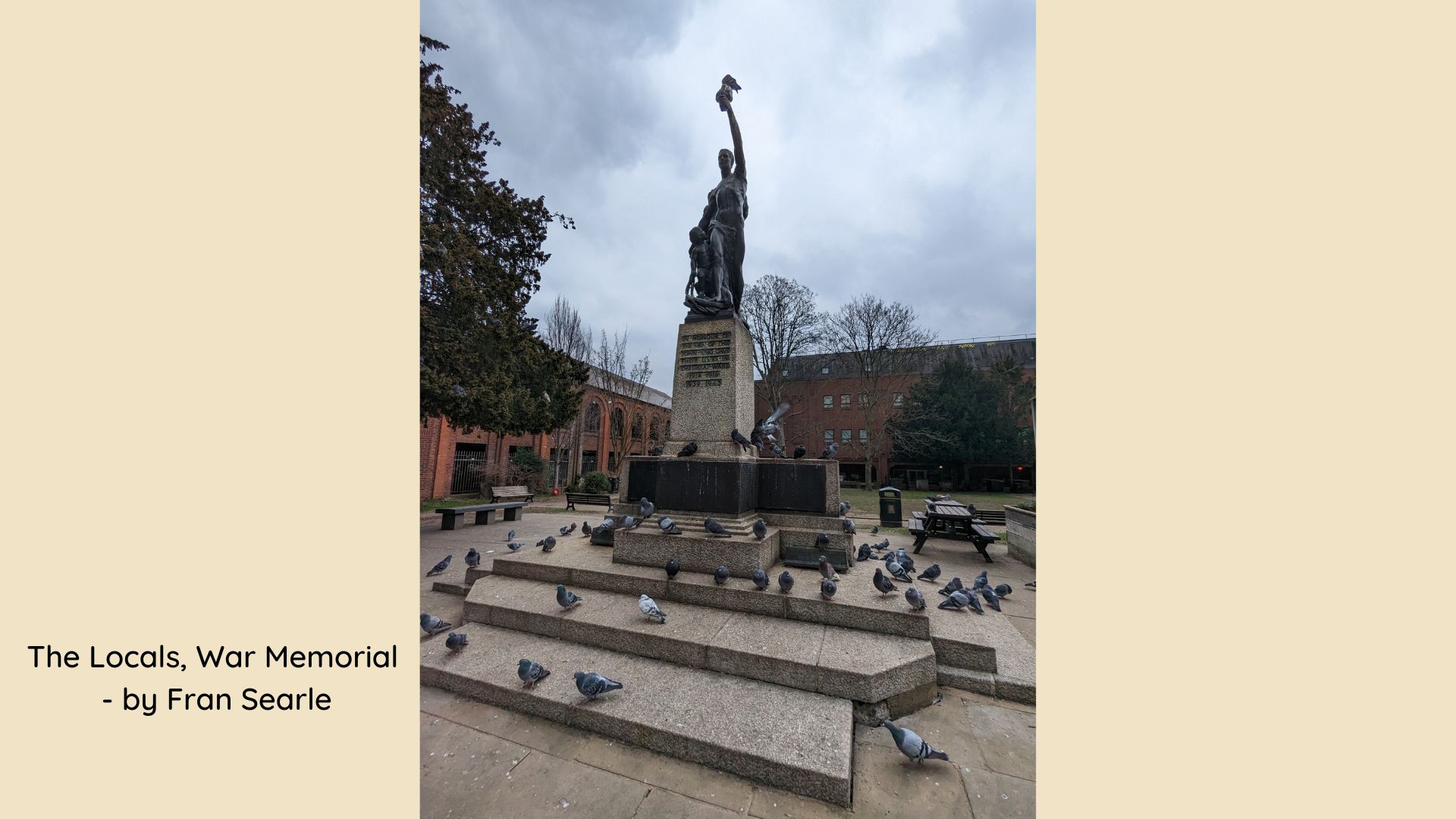 War memorial with pigeons